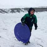 Kids swap books for boards, sleds and skis after Monday snowfall