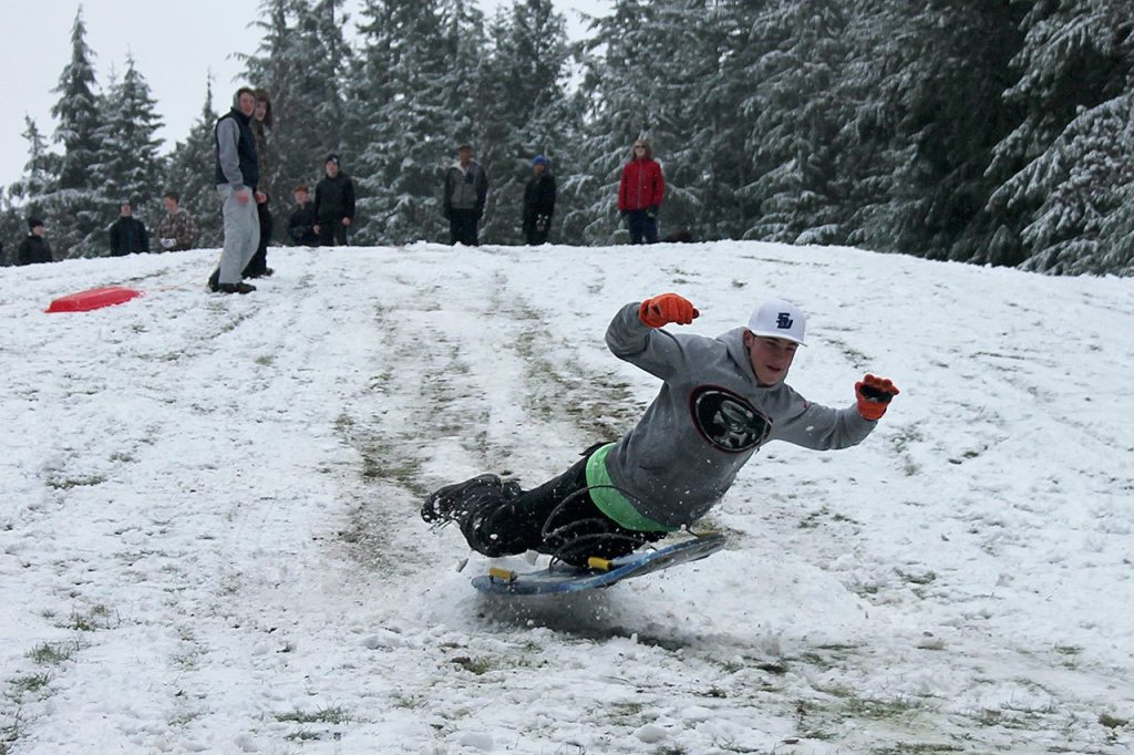 Kids swap books for boards, sleds and skis after Monday snowfall