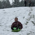 Kids swap books for boards, sleds and skis after Monday snowfall