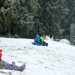 Kids swap books for boards, sleds and skis after Monday snowfall