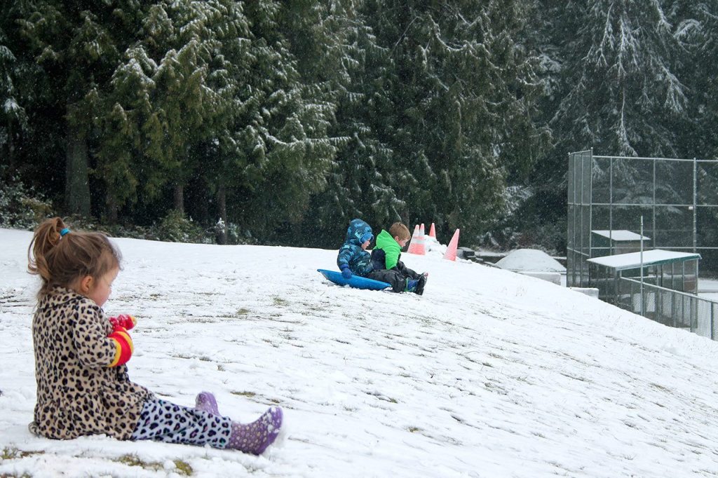 Kids swap books for boards, sleds and skis after Monday snowfall