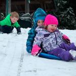 Kids swap books for boards, sleds and skis after Monday snowfall
