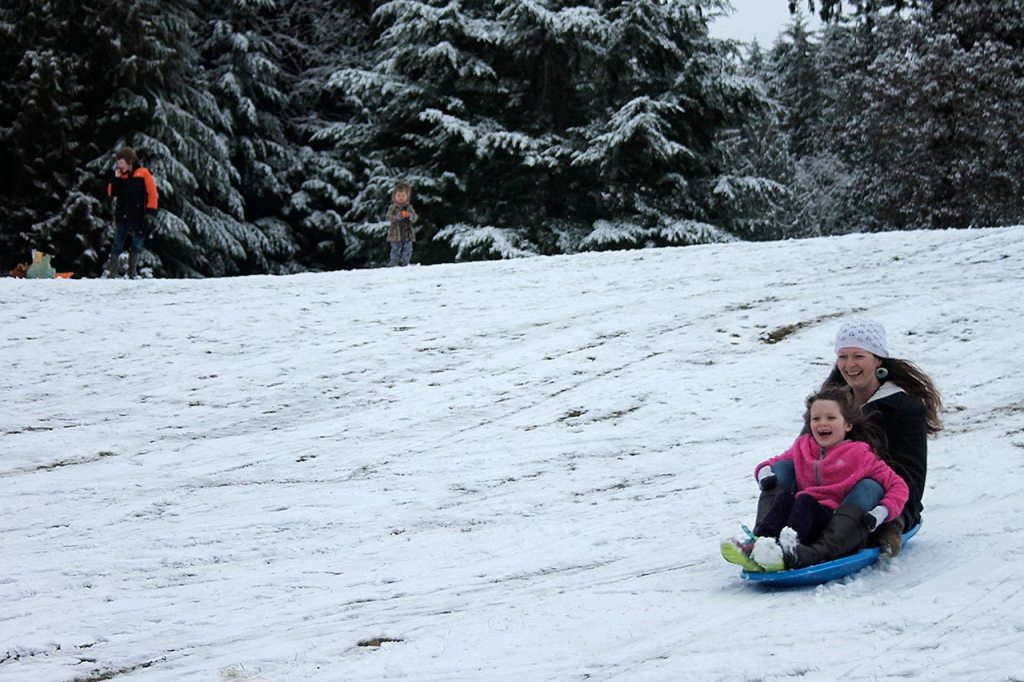 Kids swap books for boards, sleds and skis after Monday snowfall