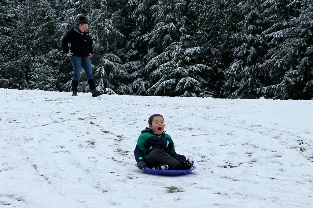 Kids swap books for boards, sleds and skis after Monday snowfall