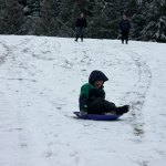Kids swap books for boards, sleds and skis after Monday snowfall