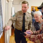 Justin Burnett / The Record                                 Jon Crimmins (left), area manager of Central Whidbey State Parks, speaks with Lagoon Point residents Louise Abbott (middle) and Dave Earp (right) about South Whidbey State Park at a public meeting Wednesday in Freeland.