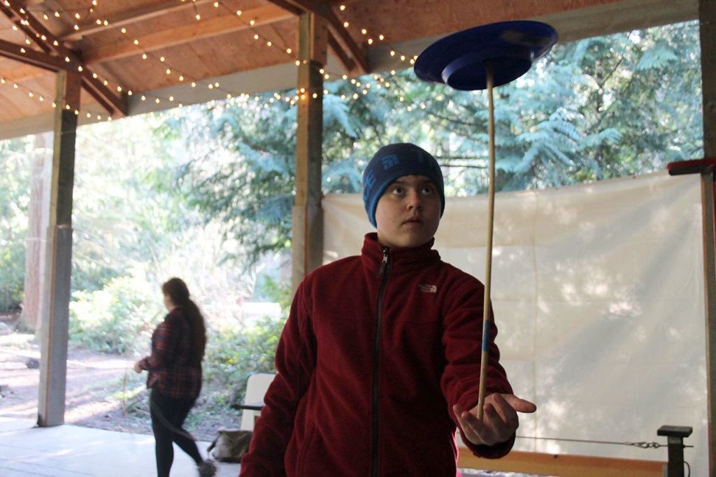 Kyle Jensen / The Record &mdash; Sixth grader Dalton Verellan spins plates during circus class.