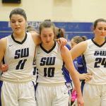 Evan Thompson / The Record &mdash; South Whidbey girls basketball players Megan Drake (11) and Bailey Forsyth (10) embrace following the Falcons&rsquo; season-ending loss to Mount Baker on Feb. 11.