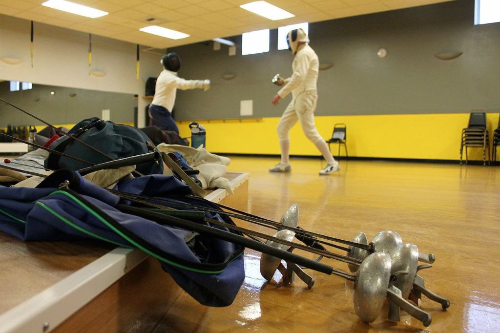 Kyle Jensen / The Record &mdash; Kleinman and Tearse bring backs full of equipment so they can partake in all three forms of fencing: foil, epee and saber.