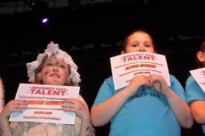 Ron Newberry / Whidbey News Group &mdash; Maggie Garrett, left, and Alyssa Monger hold up certificates after participating in the first &lsquo;Whidbey Has Talent&rsquo; at Oak Harbor High School last year.