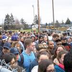 Oak Harbor High School students, evacuated to Veteran Stadium Thursday due to a bomb threat, bottleneck as they wait to be picked up by their parents or guardians. Photo by Elaine Reyes Torres.