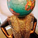 Contributed photo &mdash; Freeland carpenter and artist Janet Pheifer creates pieces from materials she often finds while working on houses. This piece, &ldquo;The World on Your Shoulders,&rdquo; is made from a mannequin, an old globe, wine foils, buttons and chains.