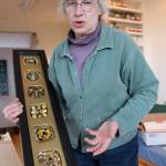 Kyle Jensen / The Record &mdash; Freeland carpenter and artist Janet Pheifer holds one of the pieces that will be featured at the exhibit. The piece is made from collected junk she meticulously organizes in her studio.