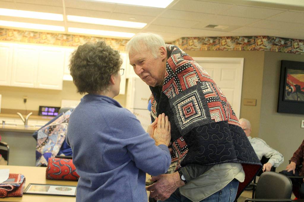 Evan Thompson / The Record &mdash; Former Marine Dan Babbitt, 83, was among those who received quilts from community organization Quilts for Veterans on Thursday at Maple Ridge Retirement and Assisted Living Community in Freeland.