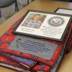 Evan Thompson / The Record                                 Twenty World War II veterans and veterans of other wars were honored on Thursday at Maple Ridge Retirement and Assisted Living Community&rsquo;s activity room. Shown in this picture is Roland &ldquo;Rollie&rdquo; Capes&rsquo;s quilt.