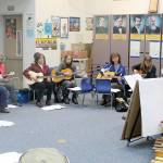 Evan Thompson / The Record &mdash; Twenty-three teachers are learning how to play the guitar so that they can integrate music into the learning experience.