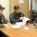 A new outreach team aimed at getting opioid drug addicts into recovery meets recently at Island County Sheriff&rsquo;s South Whidbey precinct in Freeland. From left to right are Colleen Keefe, public health nurse, deputies Grant Walker and Brent Durley, and outreach team leader Carolyn Pence. Photo by Evan Thompson/South Whidbey Record