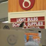 Evan Thompson / The Record &mdash; A sharp-shinned hawk sits atop a grocery aisle at The Goose on Wednesday. The small hawk spent 12 hours in the store before being captured and later released by falconer Steve Layman.
