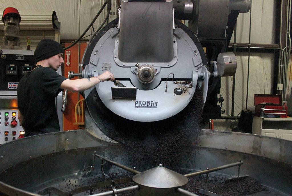 Kyle Jensen / The Record &mdash; Roaster Jake Torget operates the vintage roaster at Mukilteo Coffee Roasters.