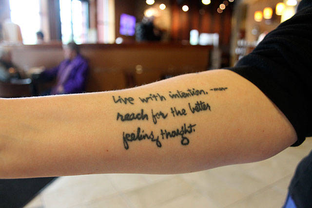 Kyle Jensen / The Record &mdash; Follower and friend Alice Johnson had excerpts from Radmacher&rsquo;s poems tattooed on her arm as daily inspiration.