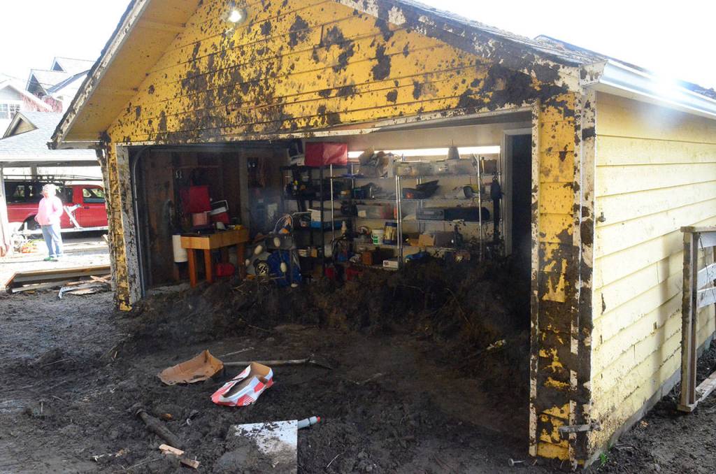 Justin Burnett/The Record &mdash; A Columbia Beach Drive home was damaged Monday during a mudslide. It was one of several that has hit South Whidbey over the past two weeks.