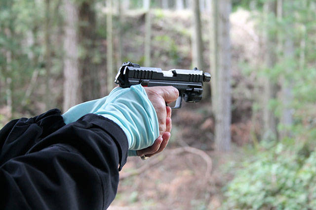 Kyle Jensen / The Record &mdash; Students practice with target 22 pistols.