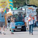 Record file &mdash; People walk up Second Street from Anthes Avenue for the annual Welcome the Whales Parade in Langley on April 18, 2015. The parade will return to Langley on April 8.