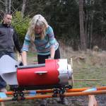 Brittany Brazelton does a safety check before her son Wyatt goes on a ride around the roller coaster track Wednesday, March 1, 2017. Photo by Ron Newberry/Whidbey News-Times