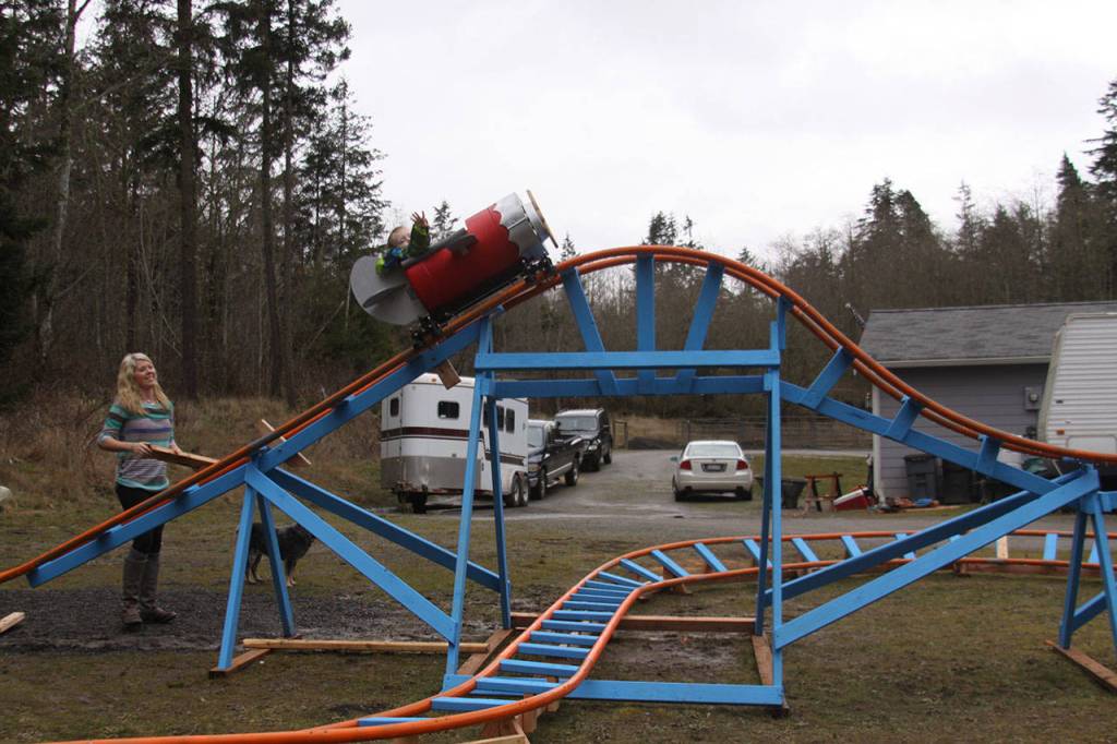 Brittany Brazelton watches before her son Wyatt goes on a ride around the roller coaster track Wednesday, March 1, 2017. Photo by Ron Newberry/Whidbey News-Times