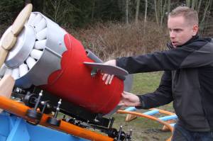 Scott Brazelton gets the roller coaster cart in position to launch at his property in Oak Harbor Wednesday, March 1, 2017. Brazelton, a Navy pilot, built a roller coaster from scratch for his 3-year-old son Wyatt. Photo by Ron Newberry/Whidbey News-Times
