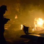 A firefighter battles a blaze that knocked out a Central Whidbey icon Monday night, March 6, 2017. The fire destroyed the historic Smith Barn at Willowood Farm in Coupeville. Photo by Megan Hansen/Whidbey News-Times