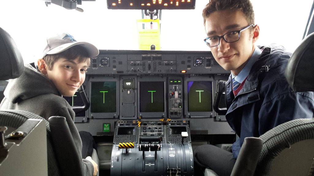 Rowen Stephens photo &mdash; Rowen Stephens prepares for flight with mentor Aaron Simpson.