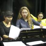 Evan Thompson / The Record &mdash; Kari Hustad, center, goes over the lyrics with other members of the Climate Arts Project at a rehearsal on Monday afternoon. From left to right: Chloe Hood, Katyrose Jordan, Hustad and Marla Kelly.
