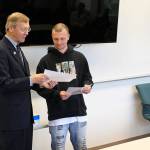 Jessie Stensland / Whidbey News-Times                                Island County Superior Court Judge Alan Hancock hands Kody Schwiger a certificate during hisgraduation from drug court last week.