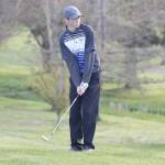 Evan Thompson / The Record &mdash; South Whidbey senior Ian Saunsaucie examines his approach shot to the green on hole 9. Saunsaucie tied for first with a 40.