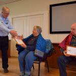 Kyle Jensen / The Record &mdash; Deer Lagoon Grange Master Chuck Prochaska presents awards to United States Navy veteran Gary Kay and Patricia Prochaska, the mother of air force veteran Roland Prochaska.