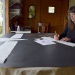 Kyle Jensen / The Record &mdash; Freeland resident Nora Harrell, also known as &ldquo;the sign lady,&rdquo; works on a sign for a new ice cream shop called Freeland Freeze.