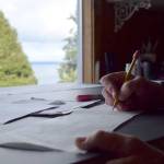 Kyle Jensen / The Record &mdash; Harrell&rsquo;s workspace is her Freeland living room that overlooks Puget Sound. She says drawing with her view is a dream job.