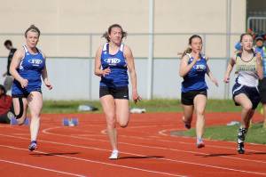 Boys, girls track teams win three-way home meet