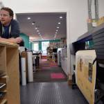 Kyle Jensen / The Record &mdash; Fine Balance Imaging + Printing co-owner Joe Menth discusses the various printers his business owns. The store can print banners, posters, art prints on different materials.