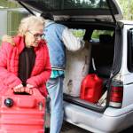 Freeland residents, Bob Brower and Debra Whitson, get help disposing of 90 gallons of gasoline that had been sitting on a boat for eight years. Photo by Patricia Guthrie/Whidbey News-Times