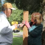 Evan Thompson / The Record &mdash; Doug Leland and Suzi Prentiss, volunteers with Hearts & Hammers, work on a fence for a homeowner&rsquo;s privacy during the non-profit organization&rsquo;s 24th annual workday on Saturday morning.