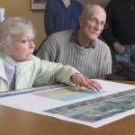 Evan Thompson / The Record &mdash; Jean and Milo Milfs examine an early schematic of the upcoming sidewalk project on First Street at a public meeting with residents and property owners on Tuesday at city hall.