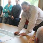 Evan Thompson / The Record &mdash; Robin Nelson of PACE Engineering discusses aspects of the First Street sidewalk project at a public meting on Tuesday at city hall.