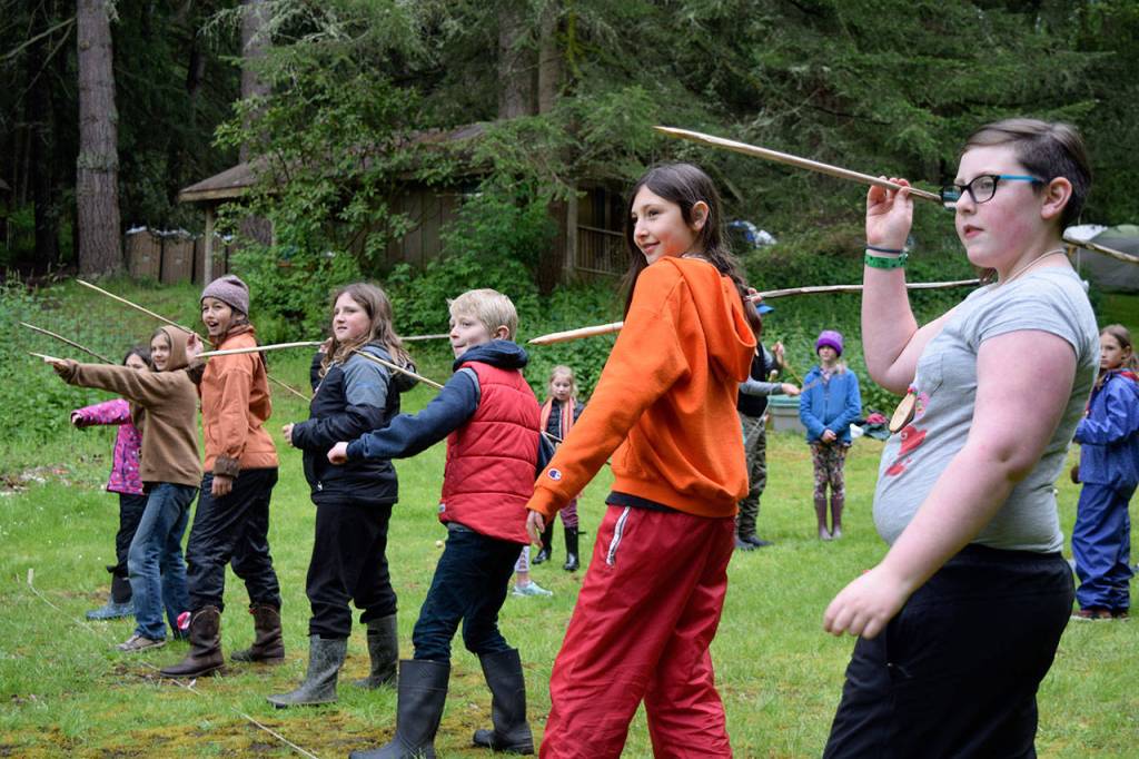 Kyle Jensen / The Record &mdash; Students prepare to practice spear throwing as part of the indigenous games portion of the program.