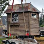 Bob Bowling photo &mdash; Bowling&rsquo;s sheds typically require a crane to lug them onto a customer&rsquo;s property. Although small and made from used materials, Bowling says his sheds are sturdy and long lived.
