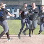 Paul Lien photo &mdash; South Whidbey freshman Makenna Morley is congratulated by her team after making the winning catch to send the Falcons to the class 1A softball championships.