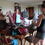 Photo by Jessie Stensland / Whidbey News-Times                                Liz Mickelson, Nikki Shorb and Anna Cavender, from left, sort clothes at a drop-in center at Ryan&rsquo;s House for Youth in Coupeville. The center has a clothes closet where young people can take clothes and other items they need.