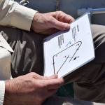 Kyle Jensen / The Record &mdash; The race committee boat glances over the process of starting a race. It serves as practice for the season ahead.