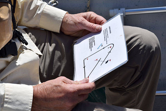 Kyle Jensen / The Record &mdash; The race committee boat glances over the process of starting a race. It serves as practice for the season ahead.